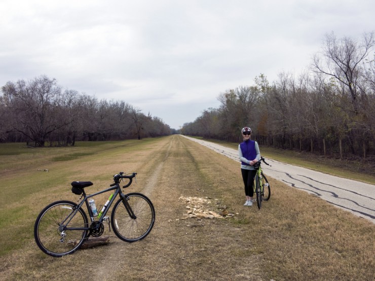 Back on the trail going through George Bush Park. Annie is holding my bike - we were taking pics of the bikes.