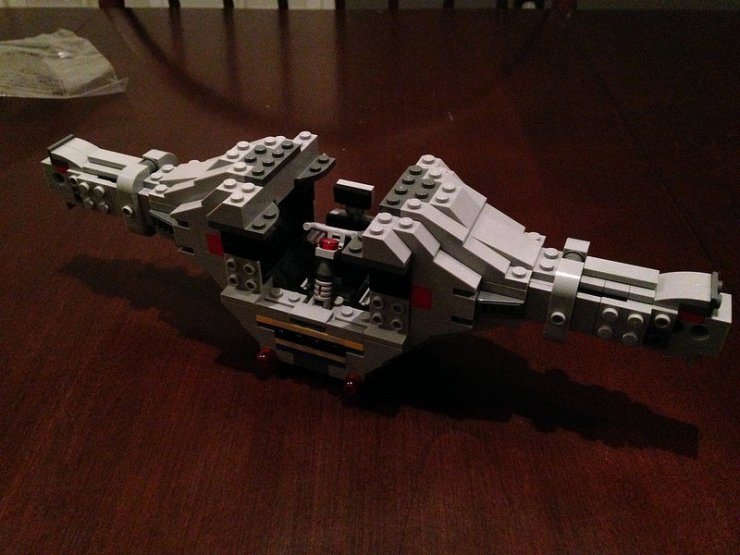 The frame of the ship begins to take shape around the cockpit area.